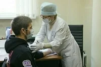 Путин подписал закон о создании единой базы медосмотров иностранцев