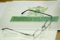 Путин подписал закон о передаче приставам данных о смерти должников