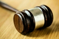 Американца Татера арестовали на 2 месяца по делу о нападении на правоохранителя