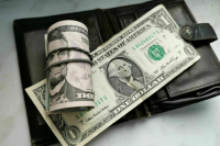Расчетный курс доллара опустился ниже 86 рублей