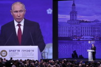 Надо повысить эффективность ВТО, заявил Путин 
